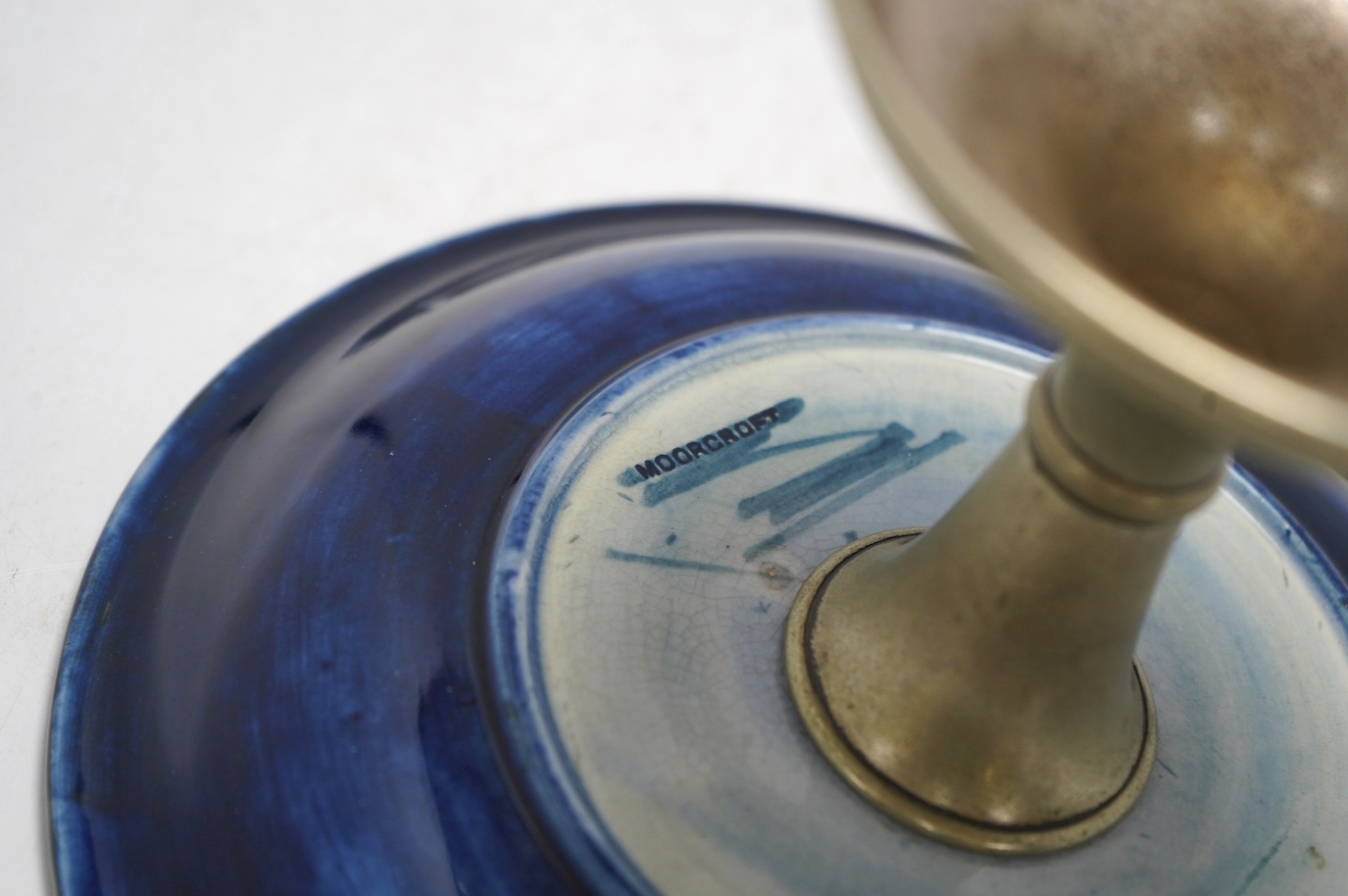 A Moorcroft Pomegranate comport, on plated metal pedestal, 14.5cm. Condition - fair, some wear to plating